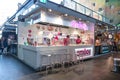 Inside market hall showing food court area with Smooy frozen yoghurt stall with company, sign, signage, logo and branding