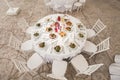 The inside of a massive white wedding tent with tables and chairs already in position. Royalty Free Stock Photo