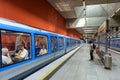 Inside the metro station in Munich. Train with passengers in modern subway