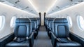 Inside a modern airplane, bright lights illuminate rows of blue seating, creating an inviting atmosphere for passengers Royalty Free Stock Photo
