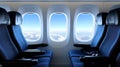 Inside a modern airplane, bright lights illuminate rows of blue seating, creating an inviting atmosphere for passengers Royalty Free Stock Photo