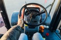 Inside modern tractor. Steering wheel. View from work place