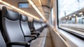 Inside a modern train, empty seats are lined up, offering a clean and comfortable space for passengers to enjoy their journey Royalty Free Stock Photo