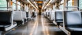 Inside a modern train, empty seats are lined up, offering a clean and comfortable space for passengers to enjoy their journey Royalty Free Stock Photo
