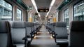 Inside a modern train, empty seats are lined up, offering a clean and comfortable space for passengers to enjoy their journey Royalty Free Stock Photo