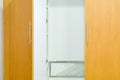 Inside a modern wood wardrobe Royalty Free Stock Photo