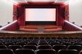 Inside of movie theatre with empty seats and stage