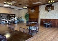 Interior of Noahs Ark Restaurant empty with owner wearing a face mask during COVID 2021 Fresno,Ca.