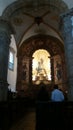 Inside the Nossa Senhora do Rosario Church. Golden and wooden details.