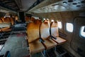 Inside of old abandoned passenger airplane. Plane wreck