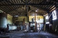 Inside Old Cannery Building with Rusted Equipment and Crumbling Wood Ceiling and Walls Royalty Free Stock Photo
