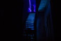 Inside of old creepy abandoned mansion. Staircase and colonnade. Silhouette of horror ghost standing on castle stairs to the basem Royalty Free Stock Photo