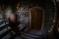 Inside of old creepy abandoned mansion. Staircase and colonnade. Dark castle stairs to the basement. Spooky dungeon stone stairs