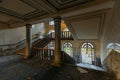 Inside of old creepy abandoned mansion. Staircase and colonnade