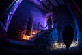 Inside of old creepy abandoned mansion. Staircase and colonnade. Silhouette of horror ghost standing on castle stairs to the basem Royalty Free Stock Photo