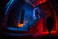 Inside of old creepy abandoned mansion. Staircase and colonnade. Silhouette of horror ghost standing on castle stairs to the Royalty Free Stock Photo