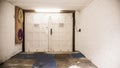 Inside an old, empty garage, garage door Royalty Free Stock Photo