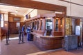 Inside the old historic train station at the wooden counter which is still nowaday in use nowadays