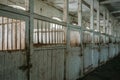 Inside old wooden stable or barn with horse boxes, corridor Royalty Free Stock Photo