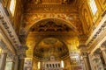 Inside the oldest church in Rome, Santa Maria in Trastevere with golden decoration and spectacular old mosaic work Royalty Free Stock Photo
