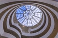 Interior winding staircase with glass rooftop of Frank Lloyd Wright famous modernist masterpiece, the Guggenheim Museum