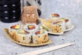 Inside out California roll sushi filed raw salmon fish, avocado, cream cheese and topped with sesame Royalty Free Stock Photo