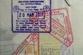 Inside page of a traveled Ukrainian passport with stamps from customs of Malaysia. Border stamp in the passport when crossing the