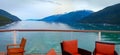 Inside passage in Alaska for ship. view of mountain and ocean from a cruise ships open bar Royalty Free Stock Photo