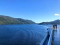 Eople admiring the beautiful blue ocean along the BC ferries inside passage route on the British Columbia coast , Canada.