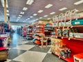 Inside a Petco pet store with center aisle showing merchandise on shelves.