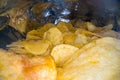 Inside the potato chips bag. Opened pack of original taste delicious potato crisps. Fast food and unhealthy eating concept Royalty Free Stock Photo