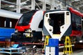 Inside of the rail car assembly plant `Stadler`. Industrial workshop for the production of high speed trains. Factory of the