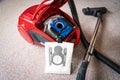 Inside A red vacum cleaner with old and new vacum filter bags laying on a white carpet floor.