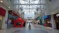 Inside of Regent Shopping Center, glass ceiling and shops on sides