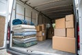 Inside of a removal van with blankets and cardboard boxes Royalty Free Stock Photo