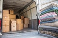 Inside of a removal van with blankets and cardboard boxes Royalty Free Stock Photo