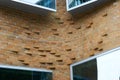 Curved orange brick wall of Dr Chau Chak Wing Building with offset bricks at University Technology Sydney UTS, Australia