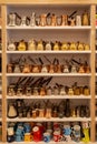 Inside of shop selling traditional turkish coffee pots, hanging copper pots, various cezve on sale, close up, low angle view in