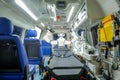 Inside smart ambulance car with medical equipment and smart robot assistant