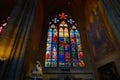 Inside st. Vitus. Cathedral and stained glass with Catholic icons.