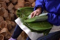 Inside a tea factory worker prepars wicker basket for the famous black tea Liu An, Anhui province, China. Royalty Free Stock Photo