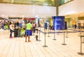 Inside of Trapani-Birgi airport with passengers waiting for the checkin.