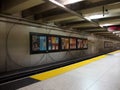 Inside Underground Embarcadero Bart Station in San Francisco with Coffee House ad on the wall Royalty Free Stock Photo
