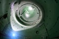 Inside unfinished reactor vessel of abandoned nuclear power plant. Bottom view of metal dome