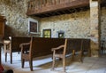 The inside of a very small ancient stone built Catholic museum Church in the historic village of Le Poet Laval in France