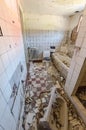 Inside view of an abandoned bathroom with debris