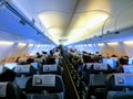 Inside view of aeroplane seating arrangements passengers seating in airplane seats