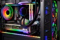 Inside view black high end custom colorful illuminated bright rainbow RGB LED gaming pc. Computer power hardware and technology