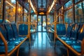 Inside view of a bus featuring blue seats and yellow railings Royalty Free Stock Photo