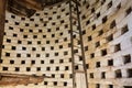 Inside view of Dunster`s dovecote with nesting holes and ladder